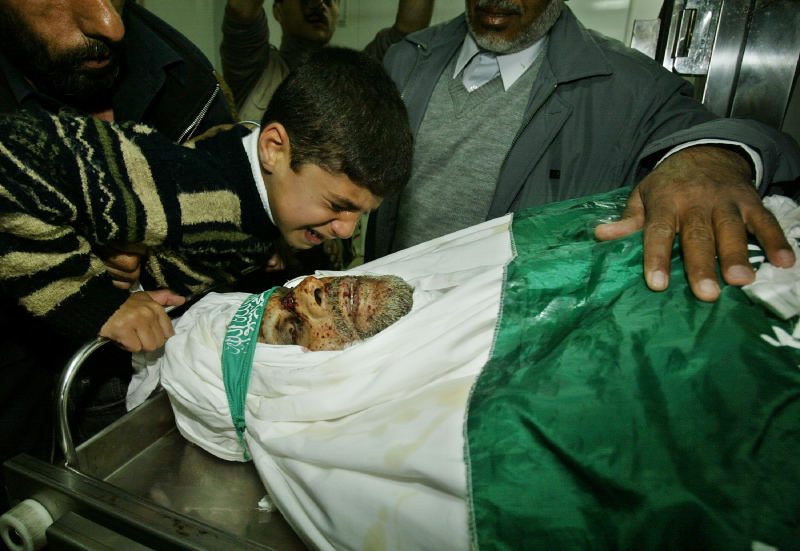 A NEPHEW OF HAMAS LEADER ABDEL-AZIZ AL-RANTISSI CRIES OVER HIS BODY BEFORE HIS FUNERAL IN GAZA