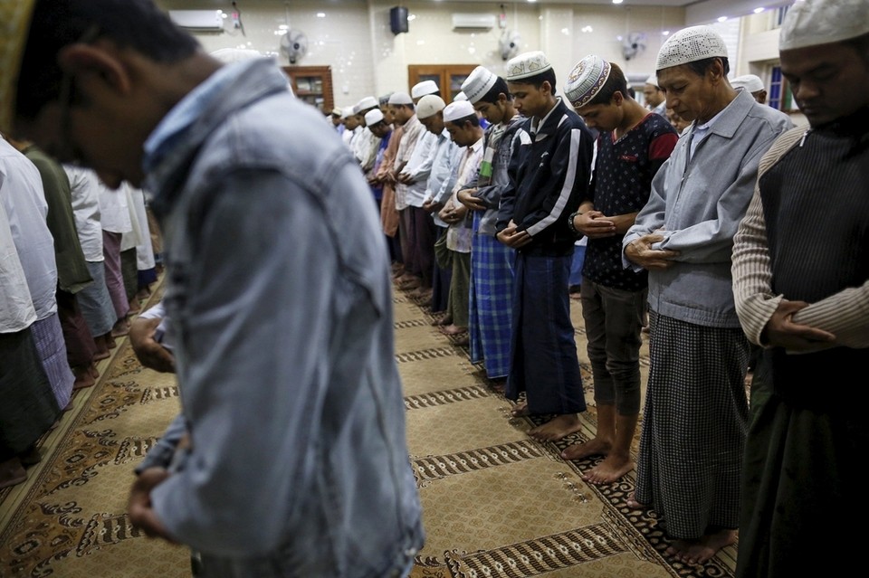 Muslims pray on the first day of Ramadan at a mosque in capital city of Shan State, Myanmar on June 19, 2015