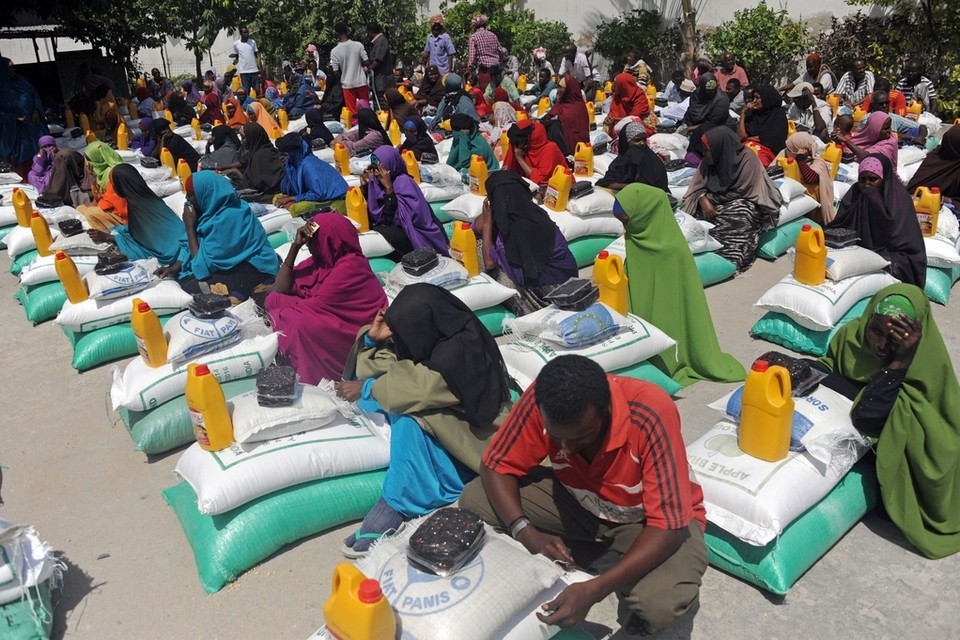Somali internally displaced people (IDP) receive food aid donated by a Qatari charity during the holy Muslim month of Ramadan in Mogadishu, Somalia on June 20, 2015. Aid is distributed to the poor and needy in the month of Rama